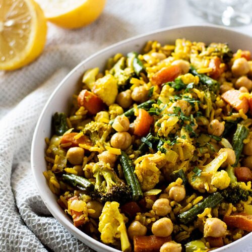 A bowl of warm indian rice salad, made of basmati rice with turmeric.