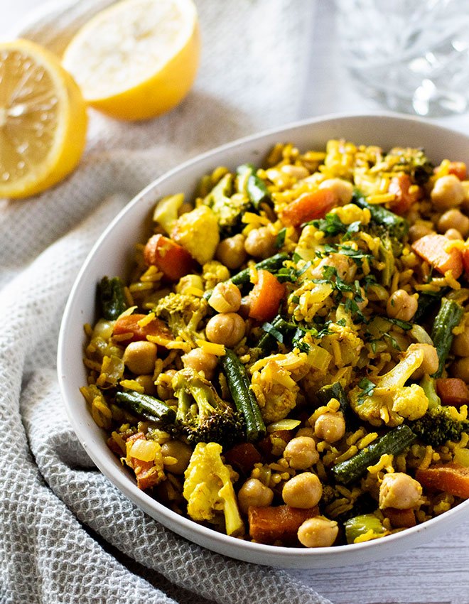 A bowl of warm indian rice salad, made of basmati rice with turmeric.