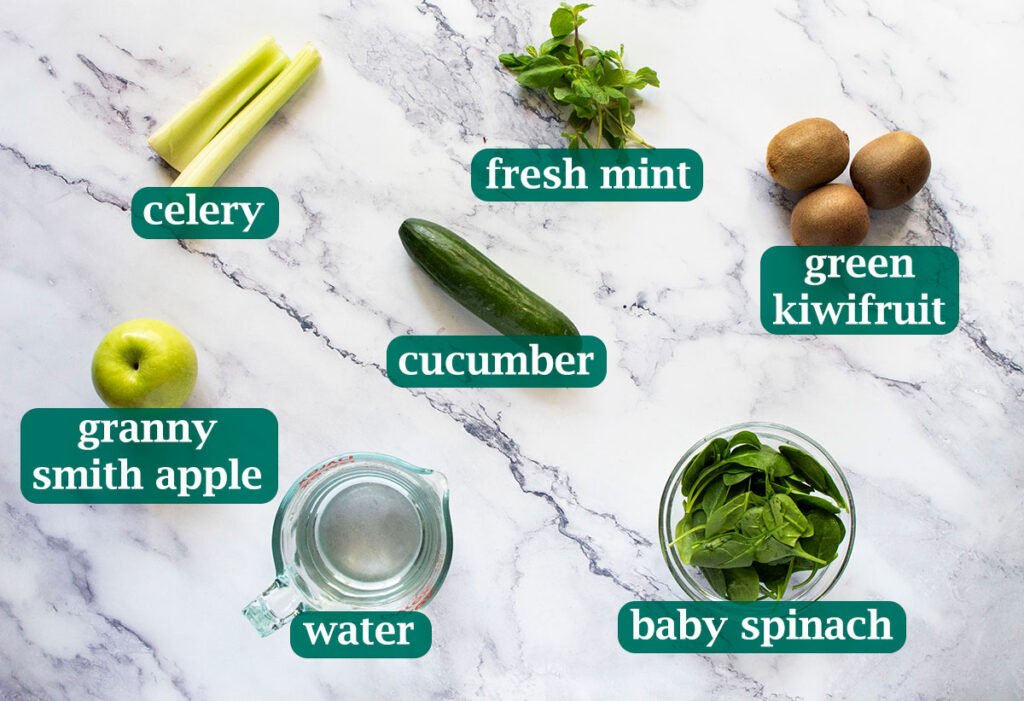 Ingredients for fresh kiwi juice with apple and cucumber.