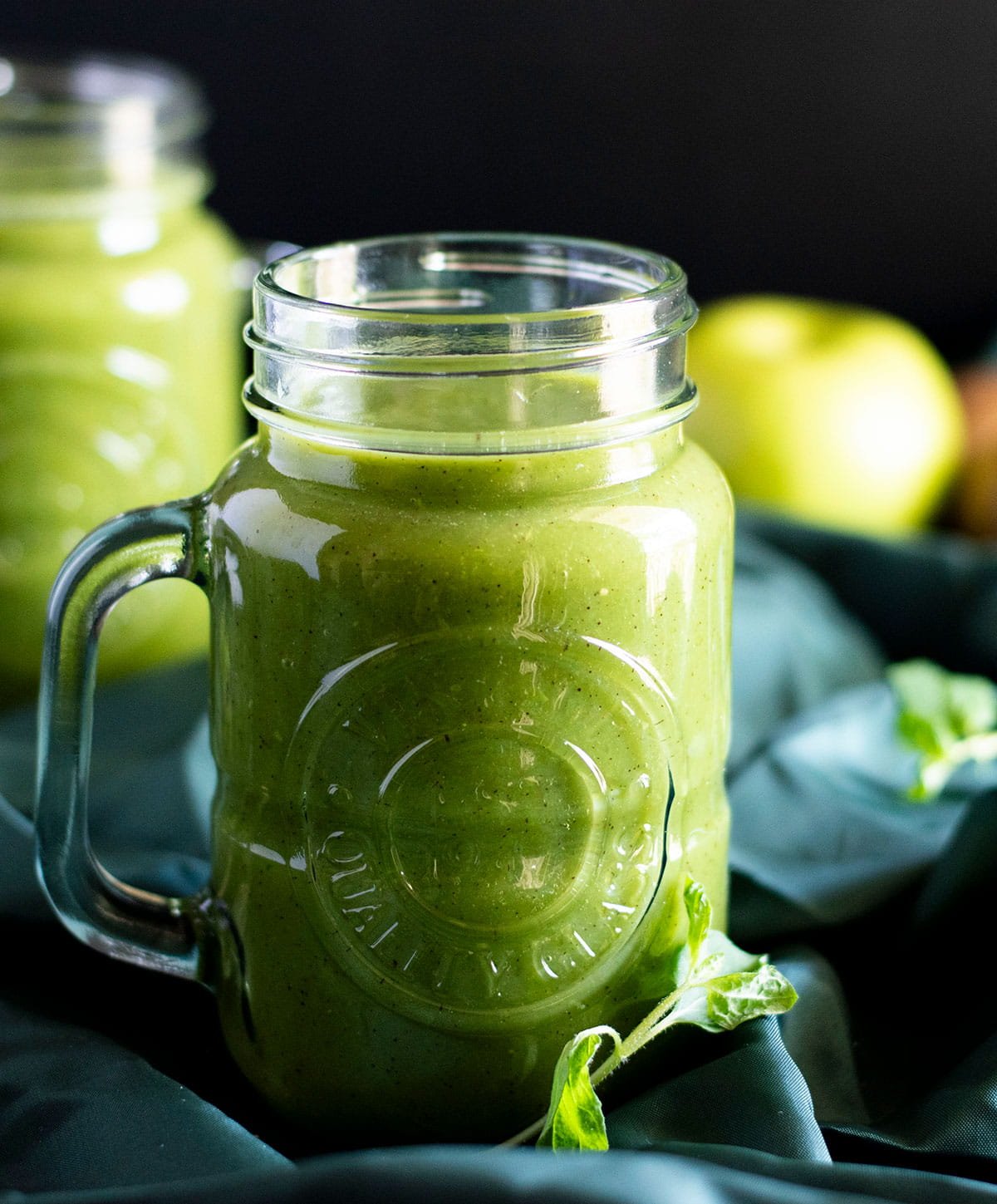 A mason jar filled with fresh kiwi juice.