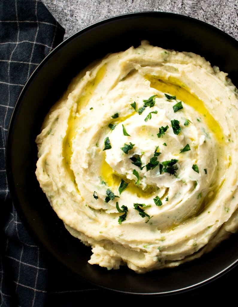 Overhead view of a bowl potato and white bean mash.