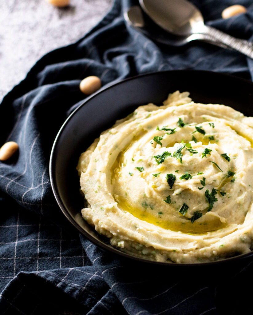 A bowl of potato and white bean mash.