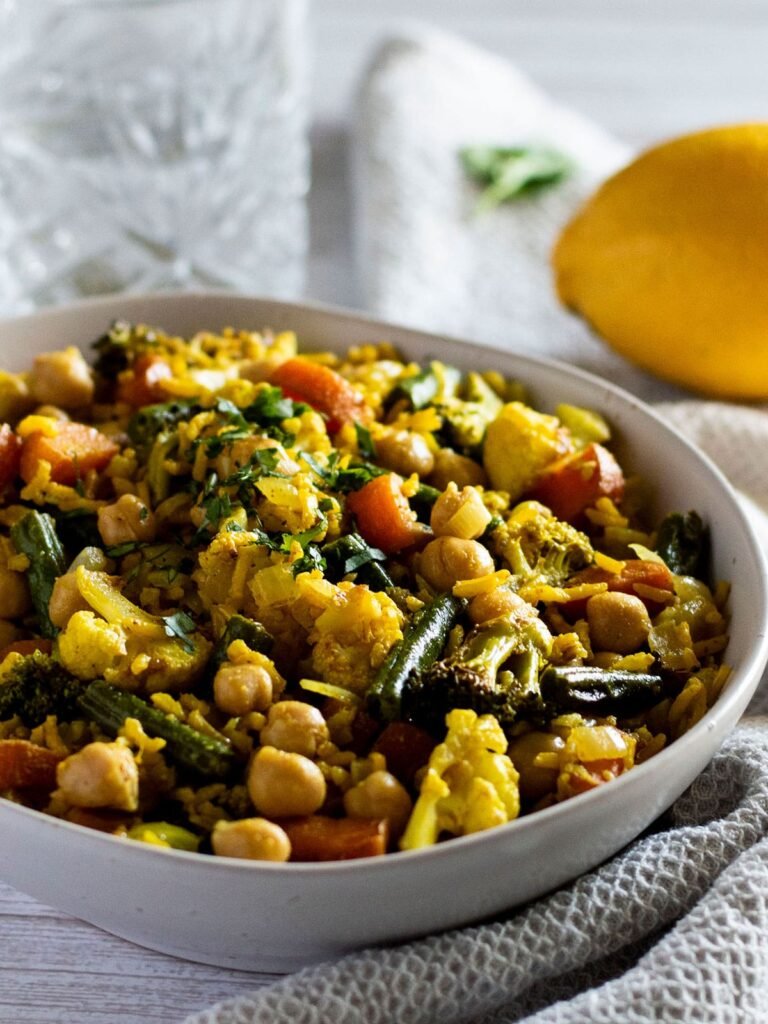 A bowl of Warm Indian Brown Rice Salad.