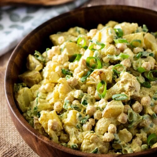 A large bowl of curry cauliflower potato salad.