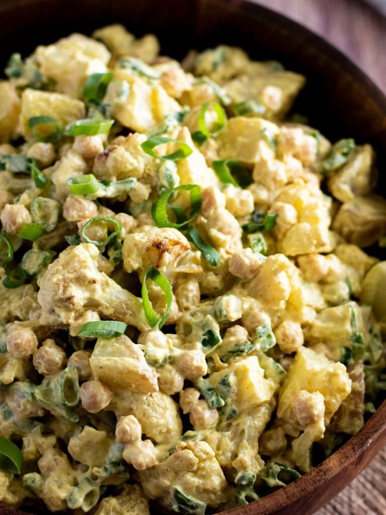 A bowl of curry cauliflower potato salad.