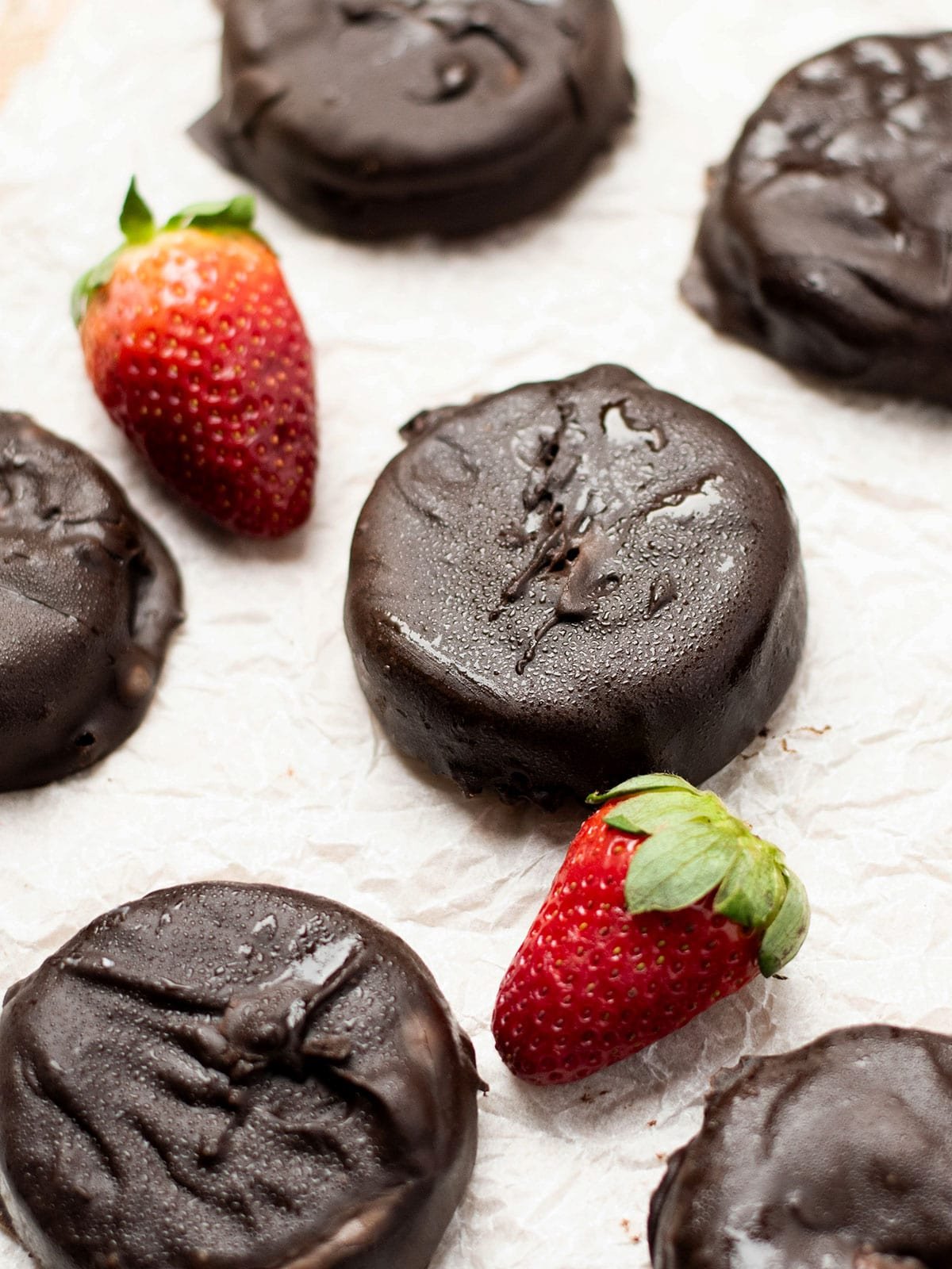 Frozen yogurt bites on crumpled baking paper.