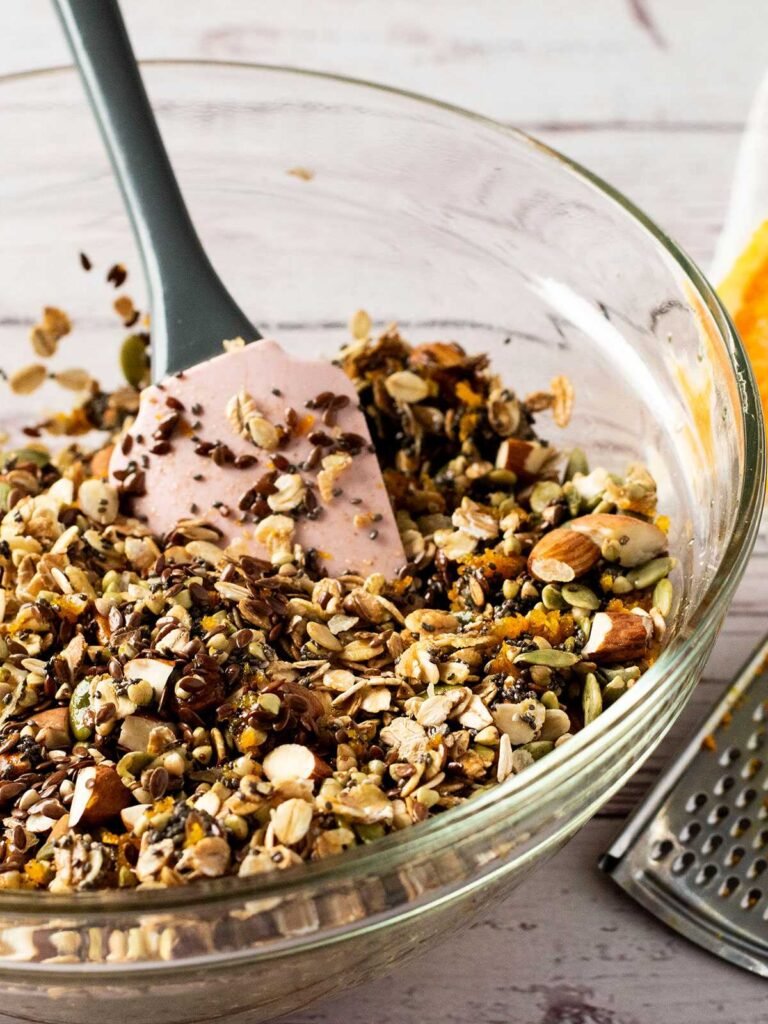 A mixing bowl full of tropical granola.