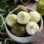 A bowl of high protein matcha balls.