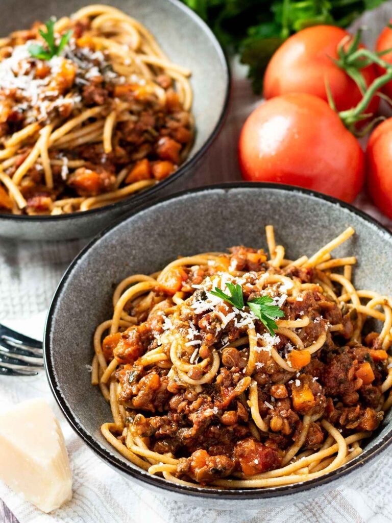 Two bowls of beef and lentil bolognese.
